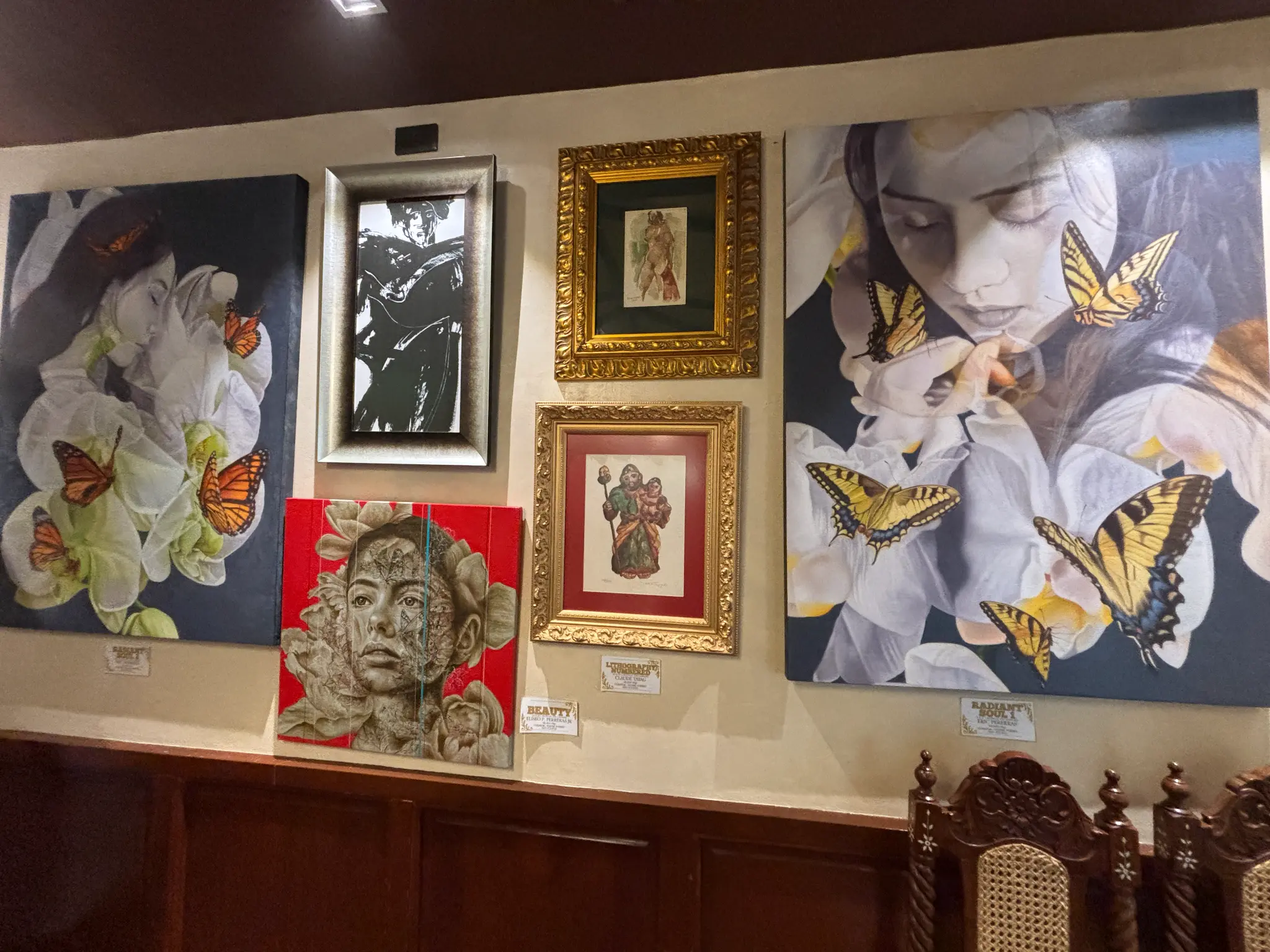 Framed artworks contribute to Consuelo’s intimate, gallery-like atmosphere.